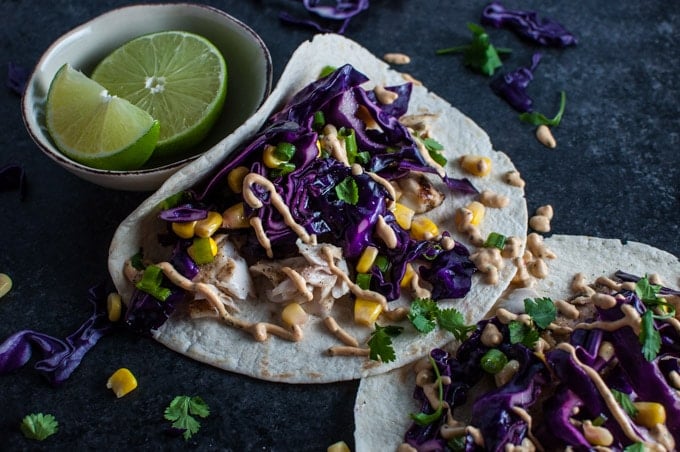 close-up of chipotle tilapia fish tacos with cilantro lime sauce