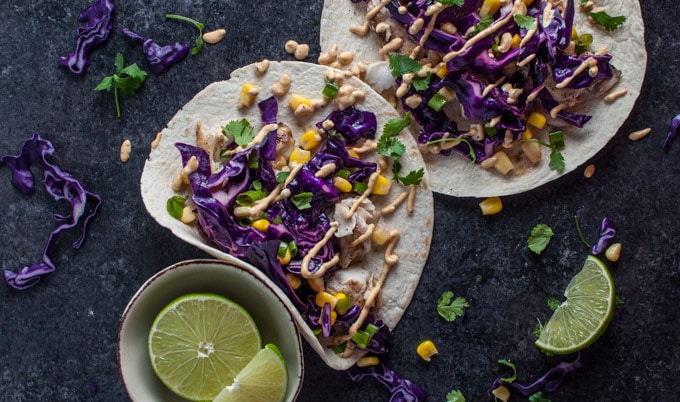 chipotle tilapia fish tacos with cabbage and corn slaw and chipotle cilantro lime sauce
