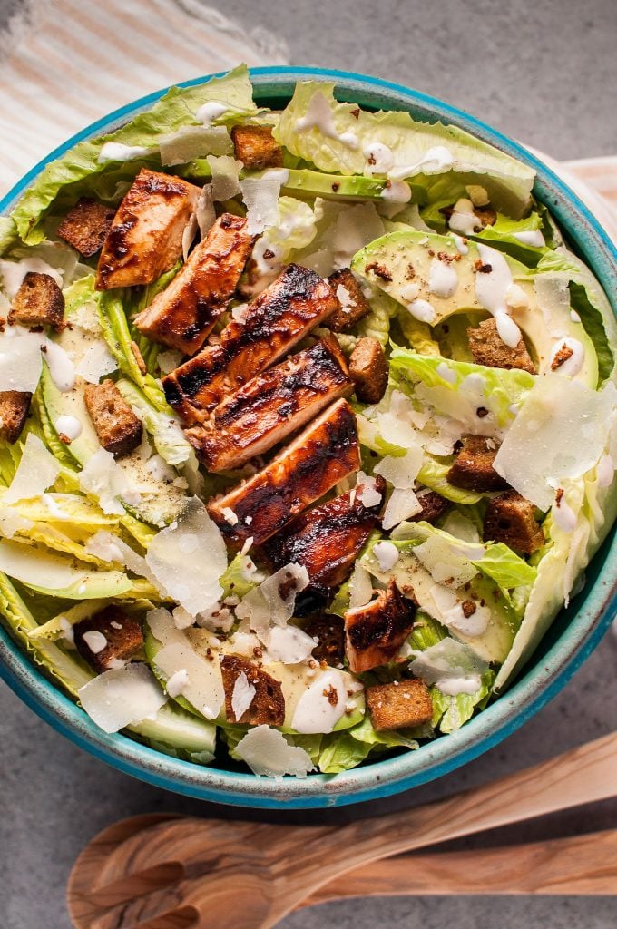 close-up of BBQ chicken Caesar salad in a large bowl