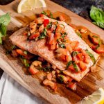 Bruschetta salmon is an easy, summery dish that is a great way to take advantage of in-season tomatoes and basil. Ready in under 30 minutes!