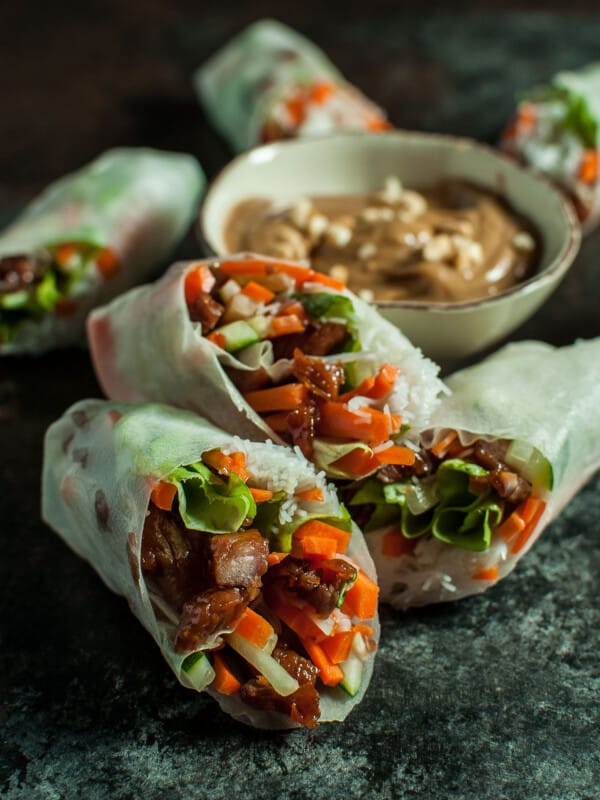 Sticky-sweet caramelized pork is complemented by crisp lettuce, carrots, and cucumber and wrapped in rice paper with vermicelli. The creamy peanut sauce makes the perfect dip for these fresh summer rolls.