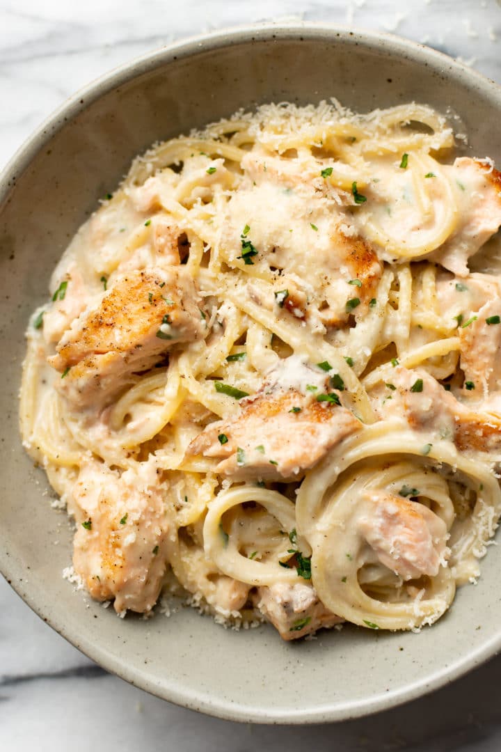 close-up of a bowl of creamy garlic salmon pasta