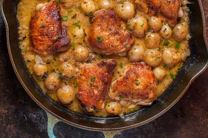 close-up of crispy lemon herb chicken and potatoes