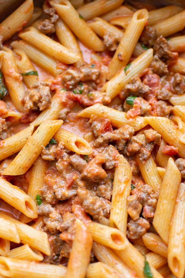 close-up of spicy Italian sausage pasta sauce with penne