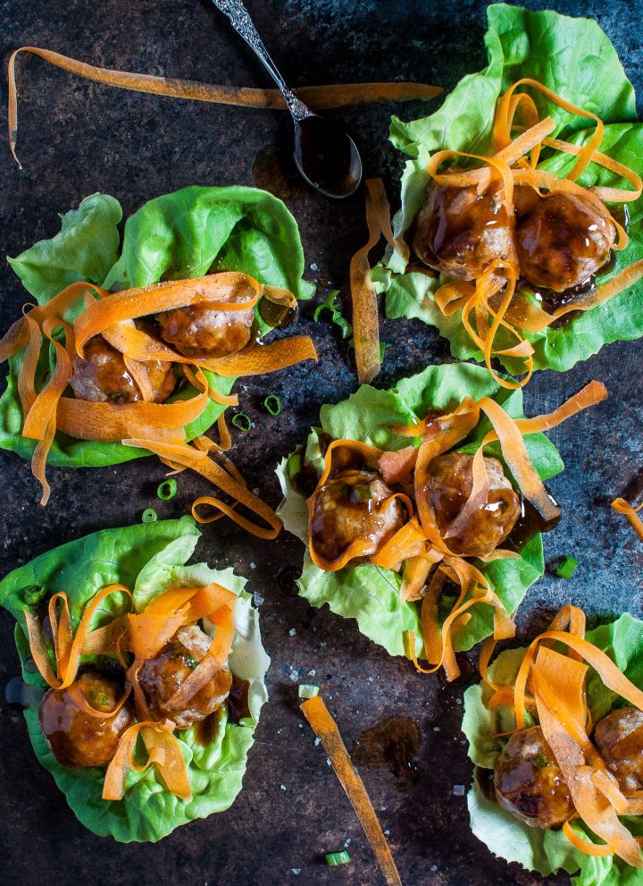 Tender, flavorful pork meatballs are coated in an easy and delicious homemade teriyaki sauce. Ribbons of carrot and butter leaf lettuce cups add some color and crunch to this lightened up meal.