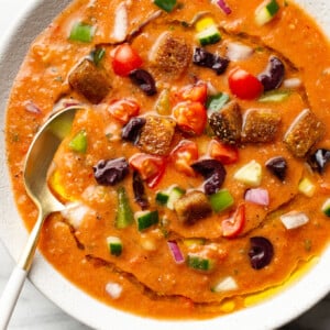 a bowl of gazpacho with a spoon