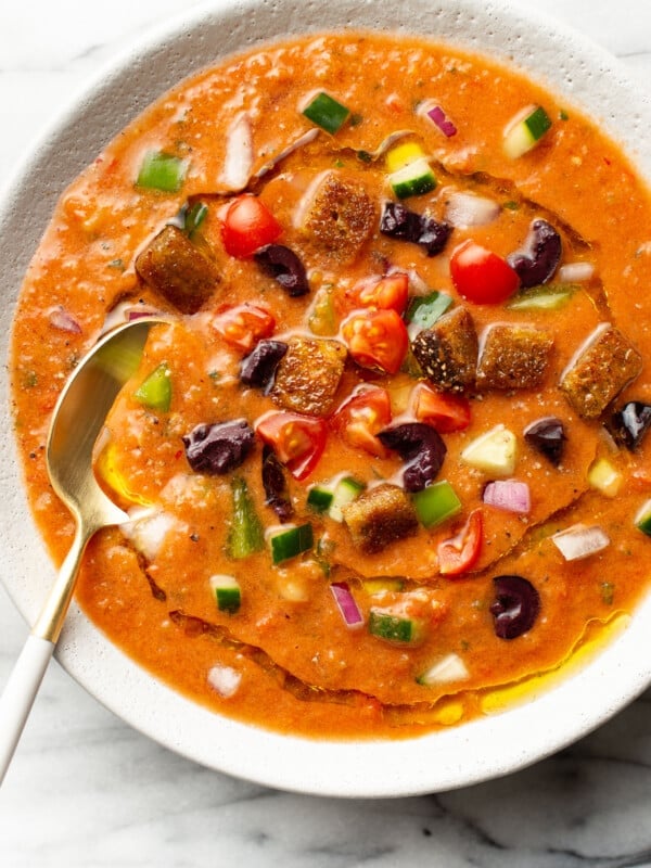 a bowl of gazpacho with a spoon