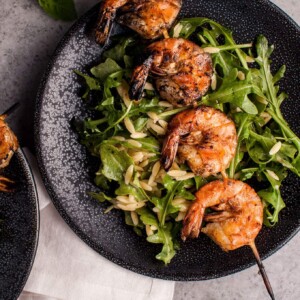 Smoky grilled shrimp, orzo, and fresh arugula tossed with a garlicky lemon dressing makes a delicious light meal or appetizer.