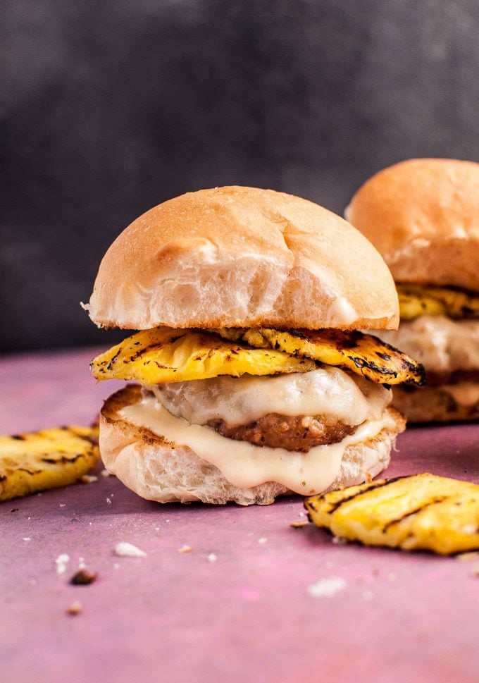 BBQ pork sliders with grilled pineapple, cheese, and a honey mustard mayo sauce