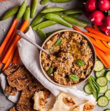 This roasted eggplant dip is easy to make and a fabulous appetizer or snack alongside your favorite veggies, crackers, or other dippables!