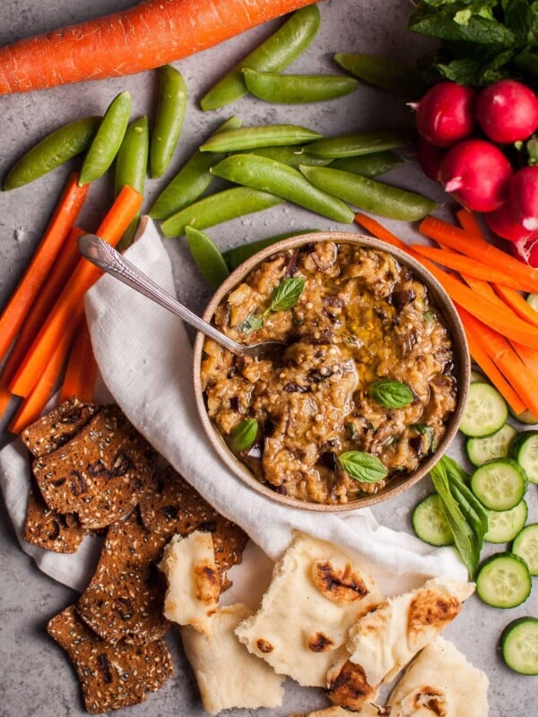 This roasted eggplant dip is easy to make and a fabulous appetizer or snack alongside your favorite veggies, crackers, or other dippables!