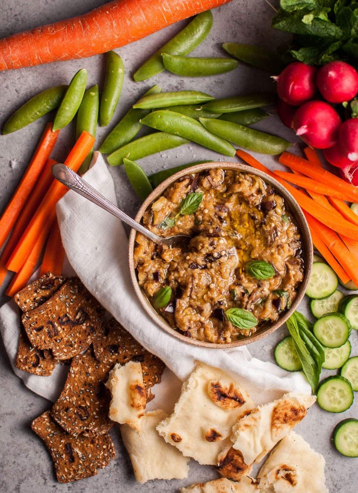 This roasted eggplant dip is easy to make and a fabulous appetizer or snack alongside your favorite veggies, crackers, or other dippables!