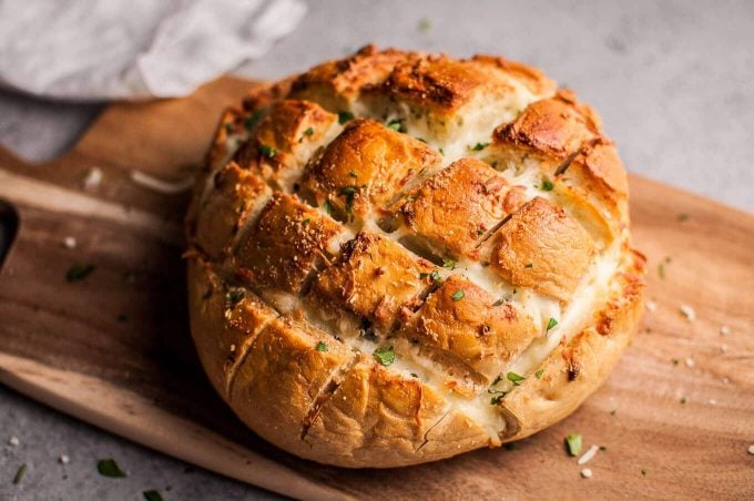 close-up of a loaf of parmesan cheesy pull-apart garlic bread