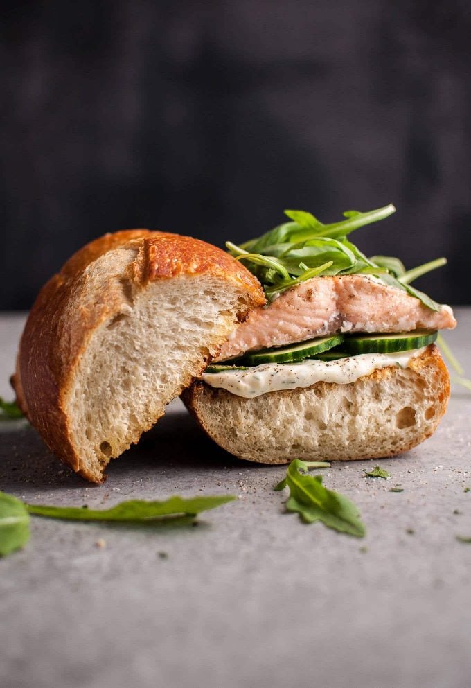 easy baked salmon with lemon mayo and arugula on a bun