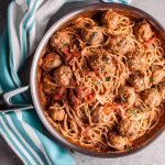 This sausage meatball spaghetti with roasted tomatoes is bursting with fresh flavor! Basil, cream, and plenty of garlic make this pasta dish a winner.