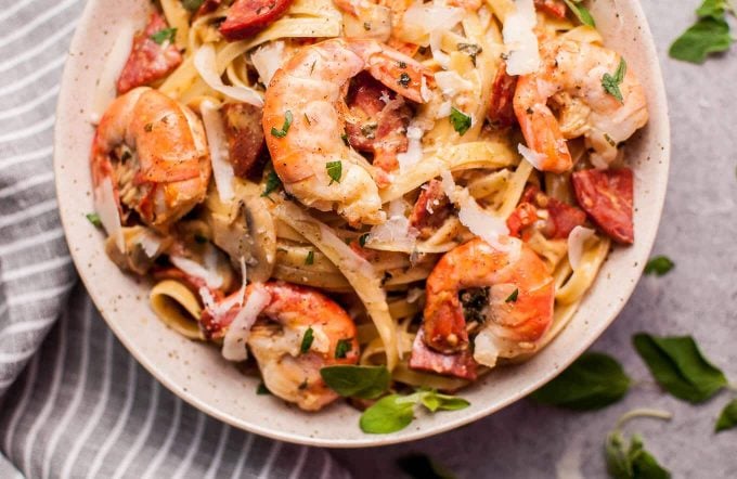 close-up of creamy shrimp and chorizo pasta with mushrooms