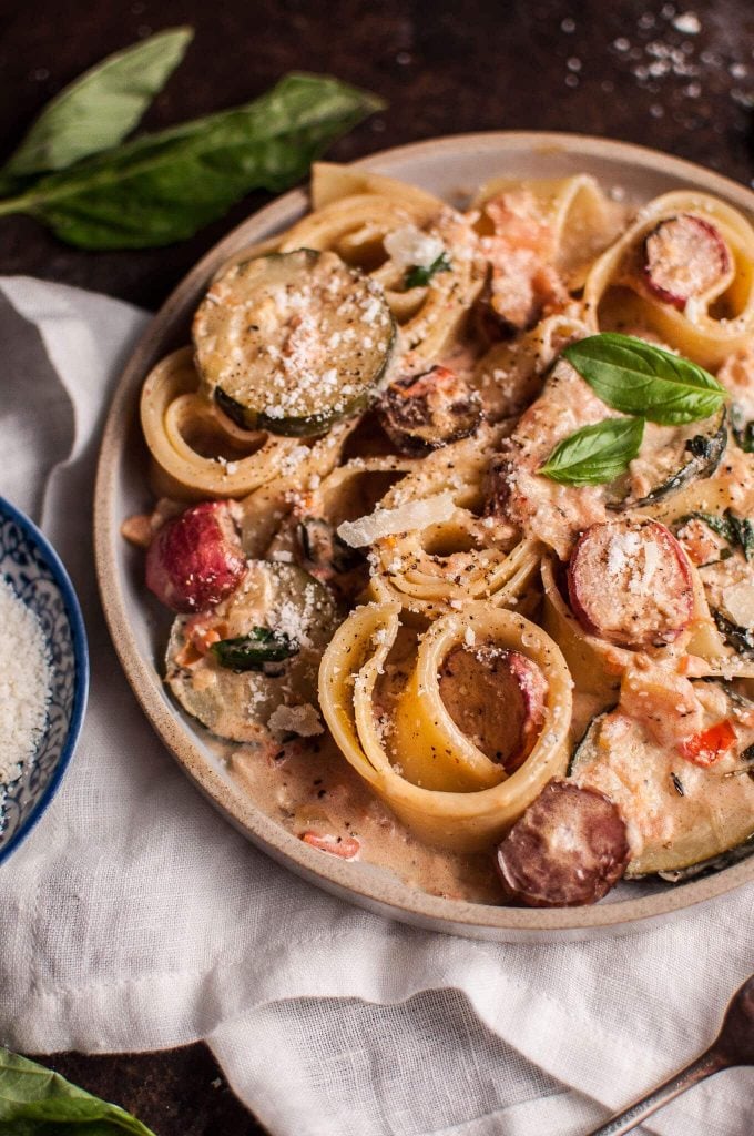 summer vegetable pasta with roasted radishes on a plate