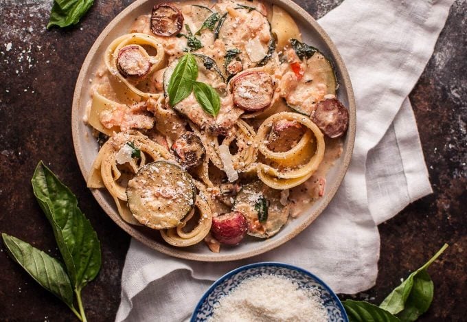 vegetarian summer vegetable pasta with roasted radishes on a plate