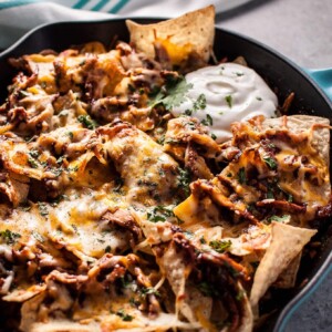 These BBQ chicken skillet nachos are fast, easy, and delicious! The perfect game-day comfort food appetizer. Ready in only 25 minutes!