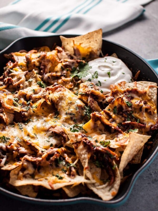 These BBQ chicken skillet nachos are fast, easy, and delicious! The perfect game-day comfort food appetizer. Ready in only 25 minutes!