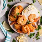 These crispy beer battered fried shrimp make an awesome appetizer! The dipping sauce is fresh and zesty.