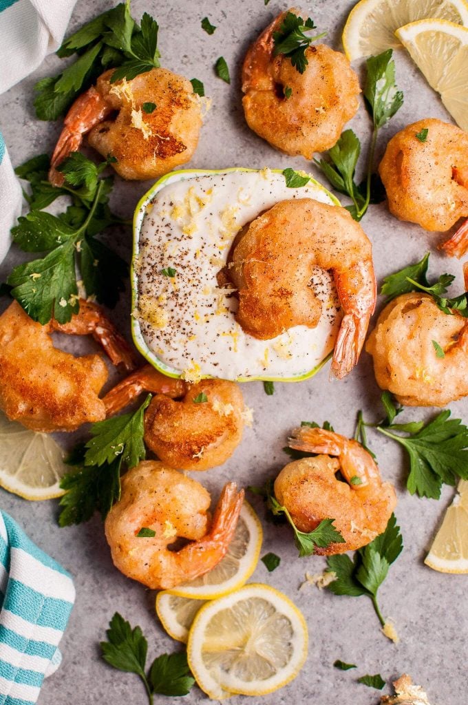 close-up of beer batter shrimp with homemade lemon mayo dipping sauce