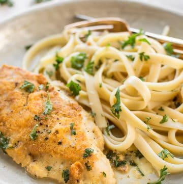 This easy Chicken Francese recipe is made with tender parmesan-crusted chicken breasts. The lemon butter sauce can be made with no wine, and it goes wonderfully with pasta or mashed potatoes!