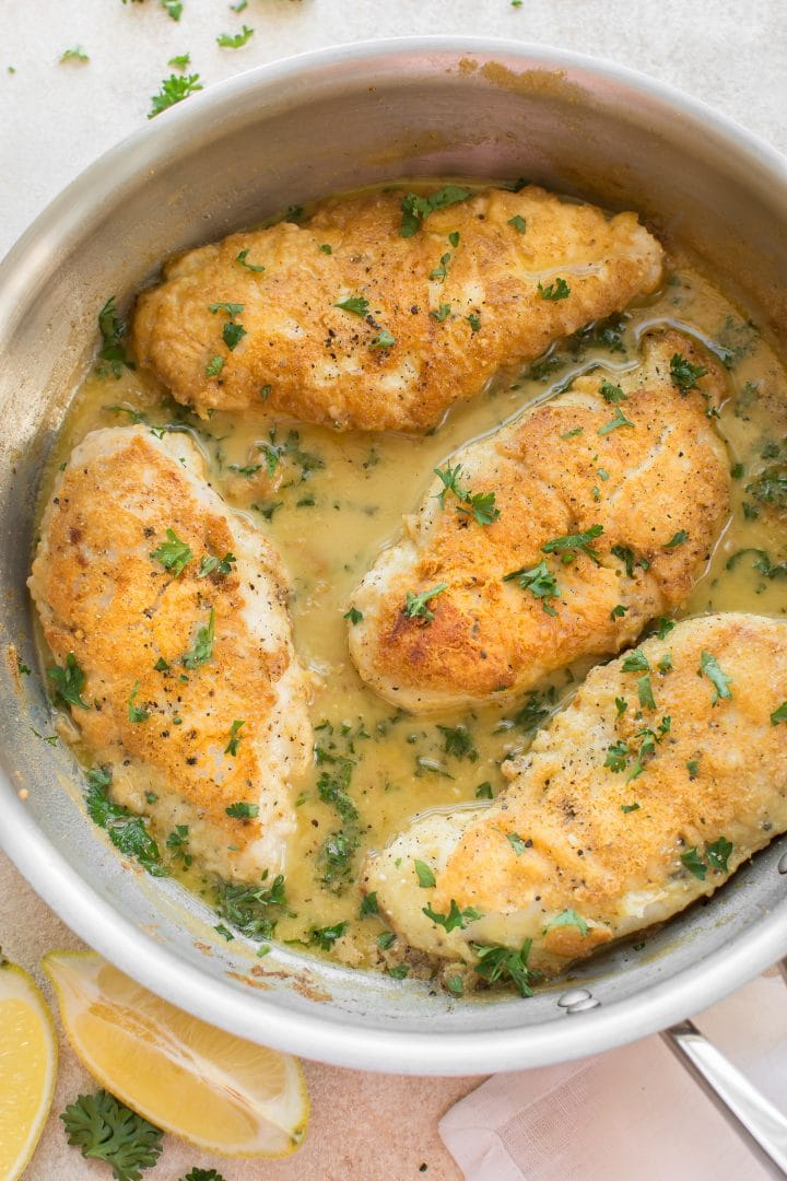 skillet with parmesan-crusted chicken breasts