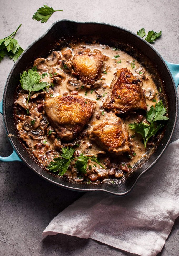 skillet with creamy bourbon chicken with pancetta and mushrooms
