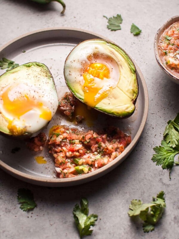 These baked huevos rancheros avocados are an easy, fresh, and light vegetarian low carb breakfast or snack idea.