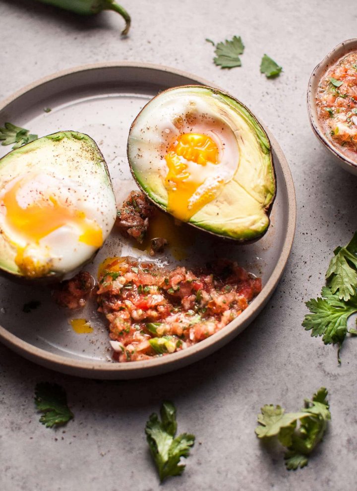 These baked huevos rancheros avocados are an easy, fresh, and light vegetarian low carb breakfast or snack idea.