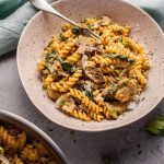 Pumpkin, mushroom, and spinach pasta is a healthy, comforting, and filling vegetarian fall dish.