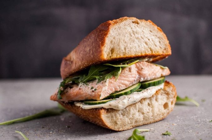 close-up of easy baked salmon sandwich with lemon mayo and arugula