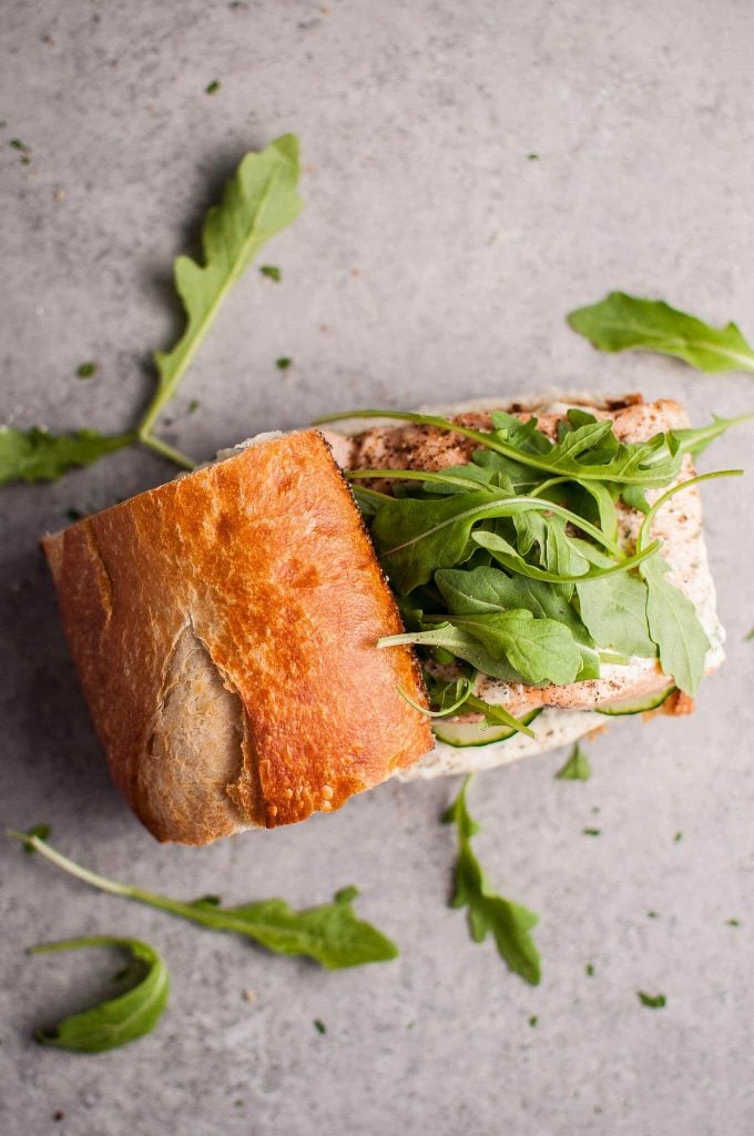 baked salmon sandwich with lemon mayo and arugula