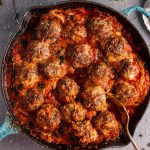 Hello cheesy baked meatball skillet of your dreams! Tender and flavorful meatballs, a rich tomato sauce, and plenty of melted cheese make this skillet recipe a winner.