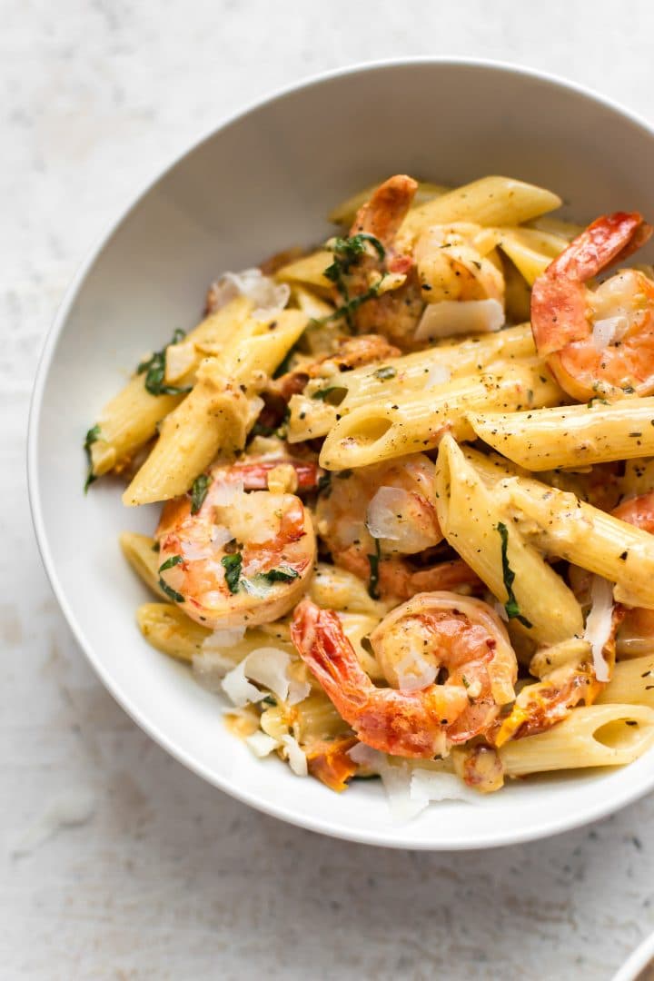 close-up of bowl of Cajun shrimp pasta in a white bowl