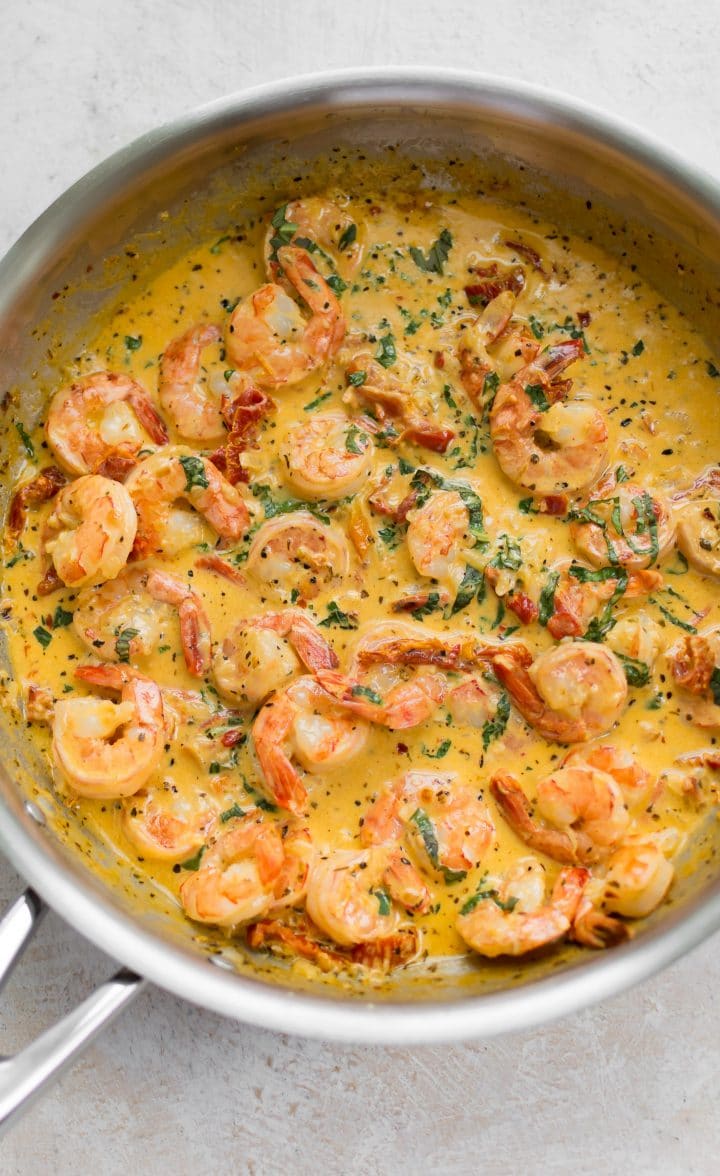 shrimp in a Cajun cream sauce in a metal skillet