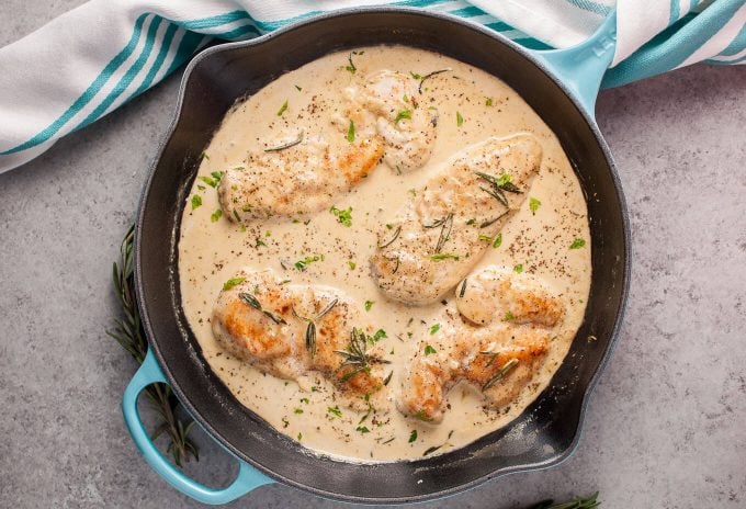 skillet of chicken with a rosemary Dijon cream sauce