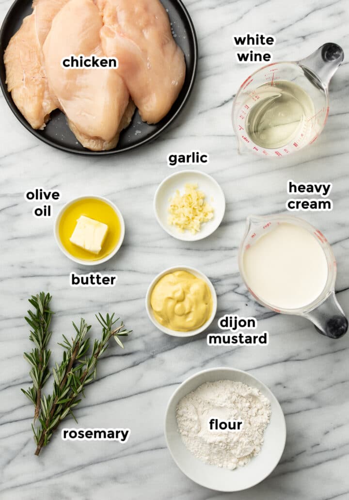 ingredients for creamy dijon rosemary chicken in prep bowls and measuring cups