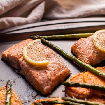 My maple salmon sheet pan dinner with sweet potatoes and asparagus is an easy, fast, delicious, and comforting fall meal!