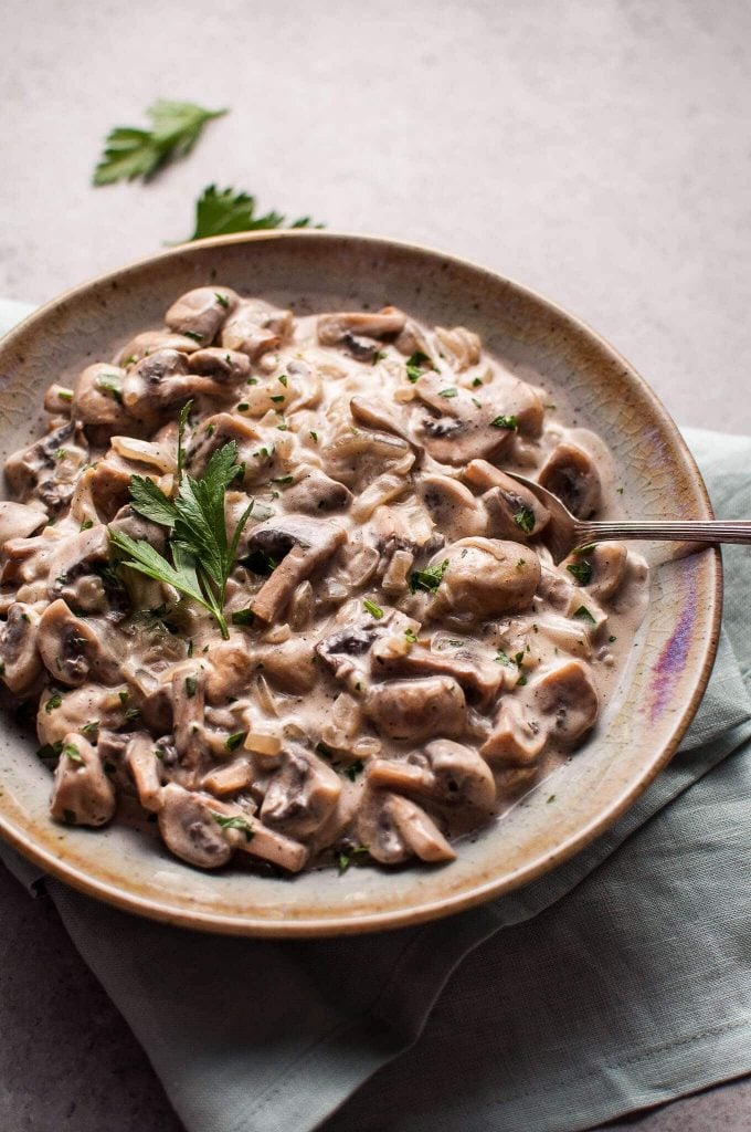 mushrooms stroganoff in a bowl with a serving spoon