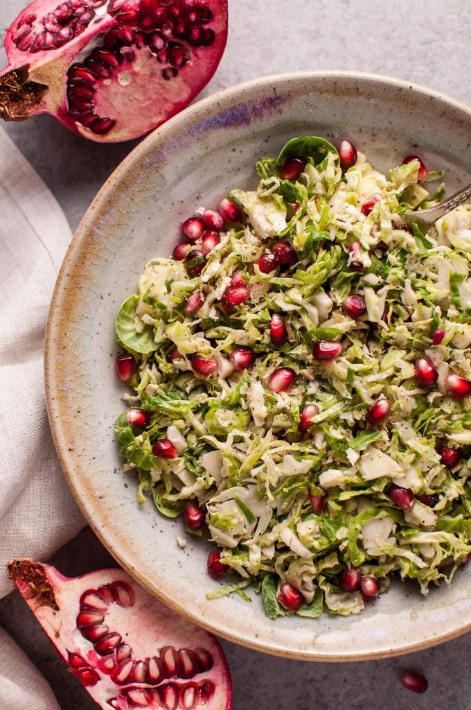 close-up of healthy pomegranate and Brussels sprouts salad in a bowl
