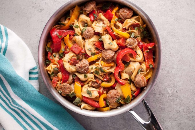 skillet with sausage, peppers, and tortellini