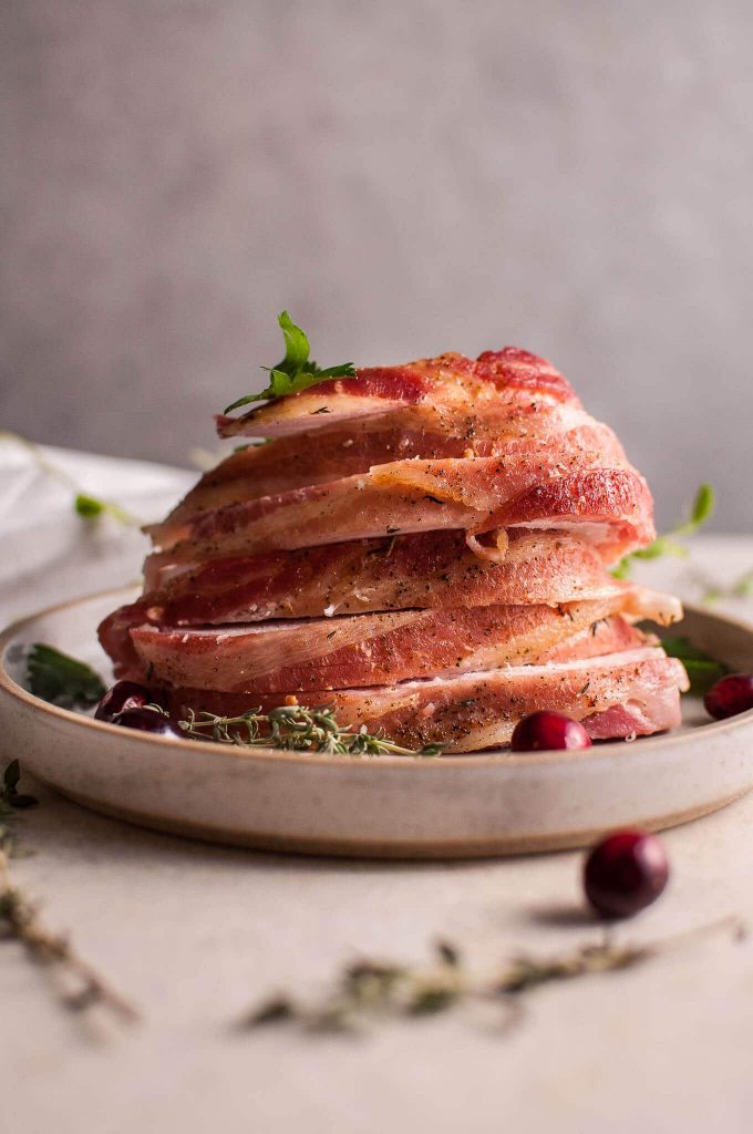 several slices of bacon-wrapped turkey breast on a plate