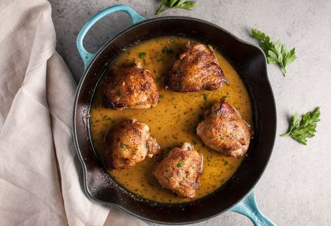 crispy honey Dijon chicken with white wine and butter in a skillet