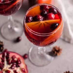 Pomegranate and persimmon winter sangria is a refreshing punch that is sure to be a big hit at your holiday party!