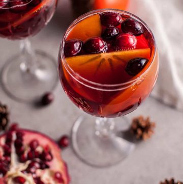 Pomegranate and persimmon winter sangria is a refreshing punch that is sure to be a big hit at your holiday party!