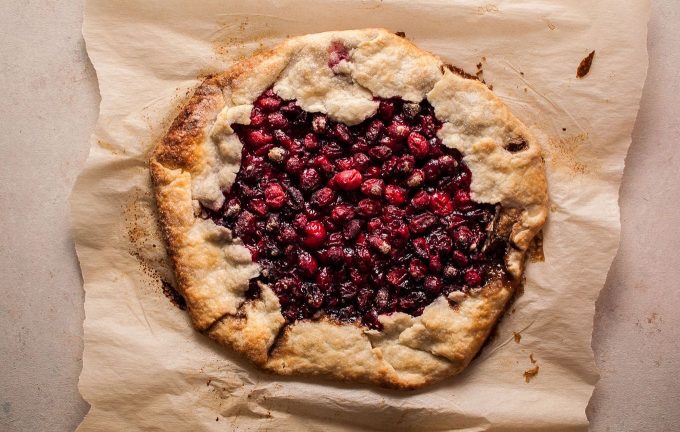 rustic cranberry galette on parchment paper