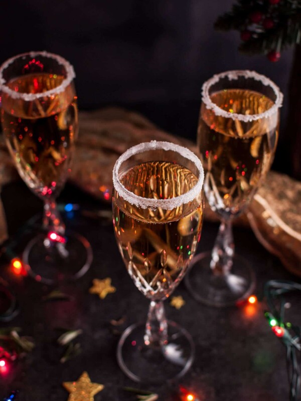 This Christmas pear champagne cocktail is simple, different, and luxe! The perfect cocktail for the holidays or to ring in the New Year. Poire Williams is added to champagne or sparkling wine to create this delicious drink.