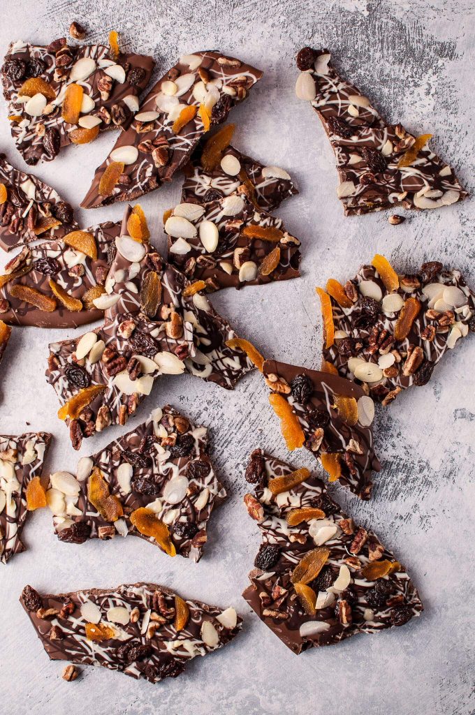 several pieces of fruit and nut chocolate bark Christmas treat